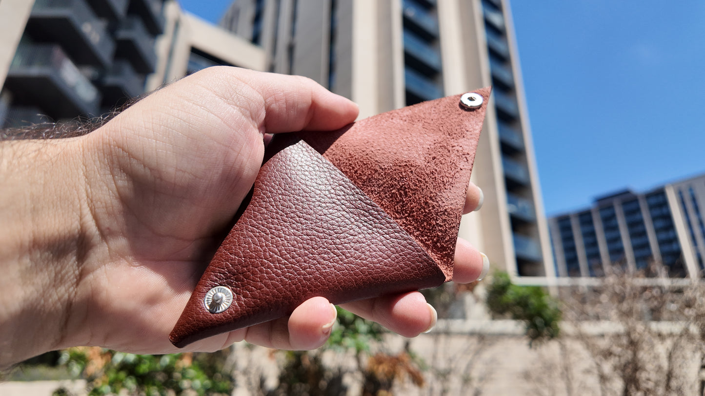 Open auburn genuine leather coin pouch revealing its soft suede interior and handcrafted construction.